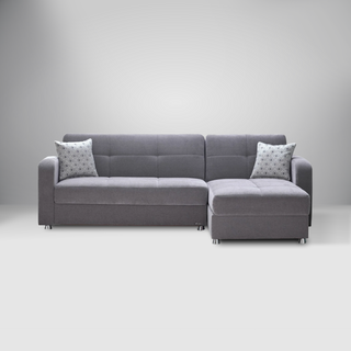 Vision S sectional sofa with button-tufting, chrome legs, and spacious design featuring built-in storage.