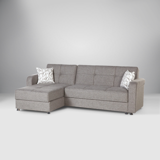 Vision Sectional sofa with button-tufted cushions, sleek chrome legs, and built-in storage.