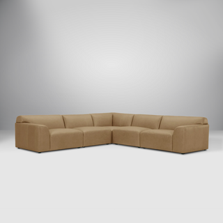 Dakota Full Leather Sectional in camel-colored leather with a sleek modern design and spacious seating.