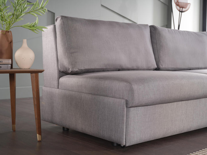 Easily convert the Ava 3 Seat Sleeper from a sofa to a bed, offering convenience for guests.