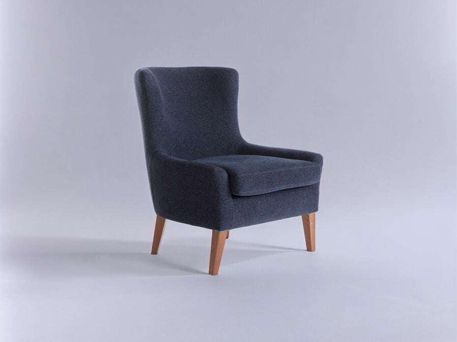 The Canyon Accent Chair featuring a modern wingback design that adds a touch of contemporary elegance to any room.