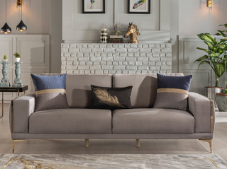 Stylish loveseat in rich velvet with contemporary design and gold trim.