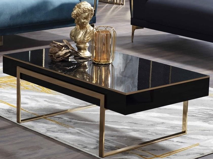 The Carlino Chrome Coffee Table with a high gloss black tabletop, adding sophistication to any living space.