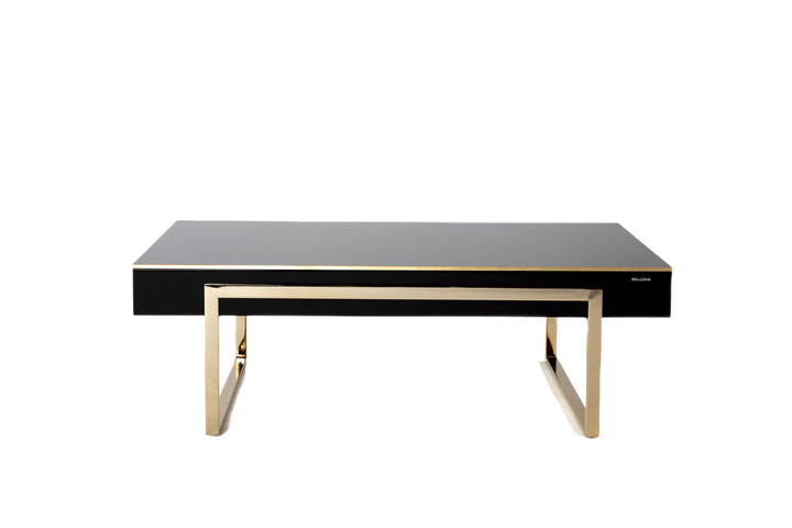 The Carlino Chrome Coffee Table featuring modern design aesthetics with golden metal legs.