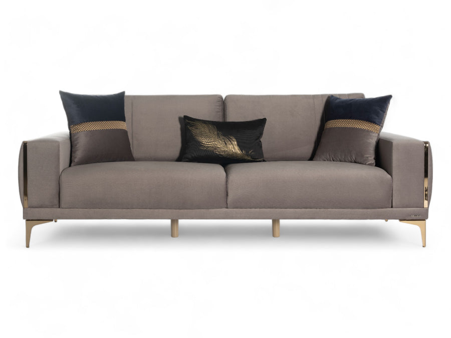 Elegant sofa with luxurious velvet upholstery and chic gold accents.