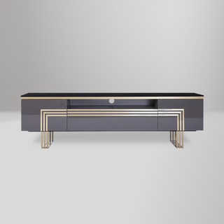 Carlino TV Stand with polished surfaces, gold trim accents, and ample storage for a chic modern living room.