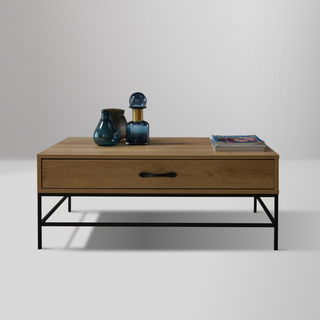 Drift Coffee Table with light finished wood body, wrought iron legs, and spacious drawer for storage.