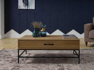 The Drift Coffee Table combines modern design with a striking contrast of wood and wrought iron.