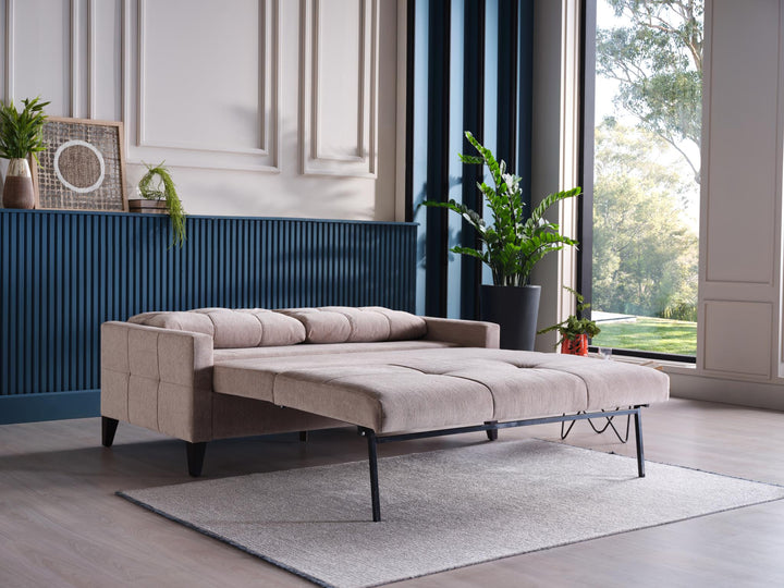 Emmett Sleeper Sofa featuring a smart built-in storage unit for blankets and pillows.