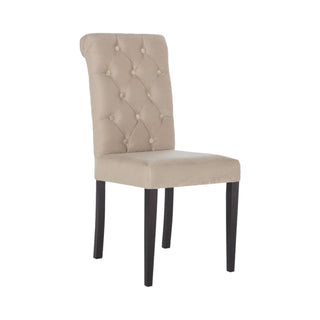 Modern James Dining Chair with sleek black legs and button tufting for an upscale dining experience.