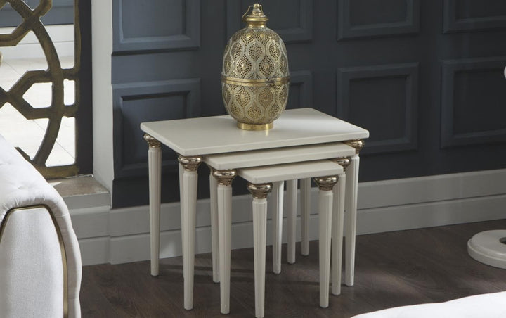 Mistral Nesting Coffee Table in opak white with chic gold accents, offering a blend of sophistication and practicality for any living space.