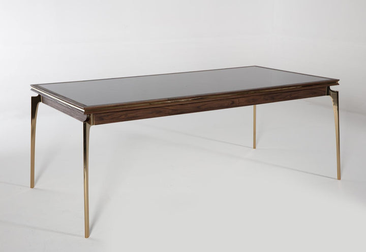 Elegant Montego Dining Table made of solid wood and metal. Sleek design suits various decor styles.