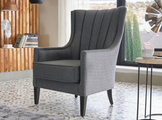 Sophisticated Palmer Armchair with a Corvet Anthracite finish and natural wood legs. Traditional design combined with modern style and durable foam cushioning.