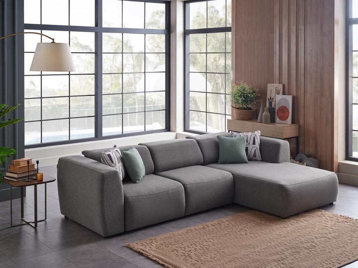 Picasso Sectional upholstered in high-quality, easy-to-maintain fabric. Features a sleek design and comfortable sleeper function.