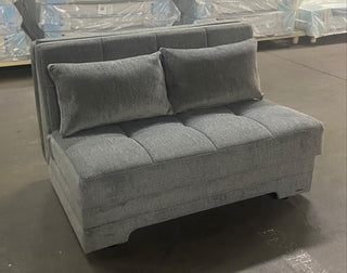 The Plush Loveseat offers dual functionality with built-in storage and a sleeper feature. Available in Anthracite, Story Red, and Astoral Light Brown, it combines modern style with practical design.