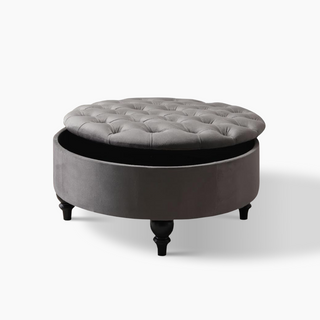 Round grey ottoman with modern elegance, plush fabric, and convenient storage under the detachable top.