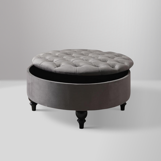 Suave Storage Ottoman in Vika Grey with button-tufted top, antique ball legs, and hidden storage space