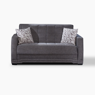 Modern Valeria loveseat featuring checkered stitching, decorative pleating, and a streamlined profile for versatile home use