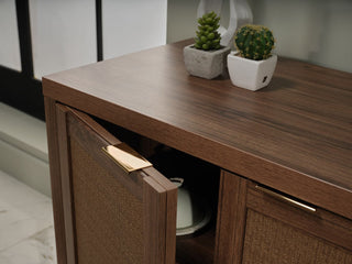 The Arden Media Console's wicker-covered cabinet doors provide an upscale boho aesthetic.