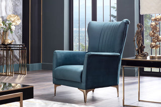 Comfortable armchair in plush velvet, enhanced with stylish gold accents.