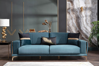 Elegant loveseat featuring soft velvet and contemporary gold detailing.