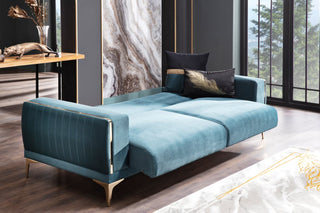 Versatile sofa with a sleeper feature, upholstered in luxurious velvet.