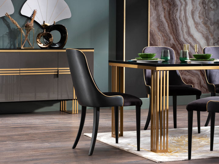 The Carlino Table with a marble tempered finish and gold accents, perfect for stylish dining or living areas.