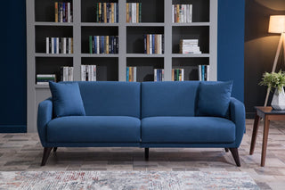 Sleeper function in the indigo blue Functional Sofa In A Box for convenience.