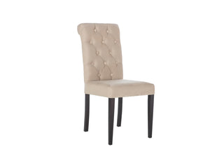 James Dining Chair with sleek black legs and a tall rolled back, ideal for stylish gatherings.