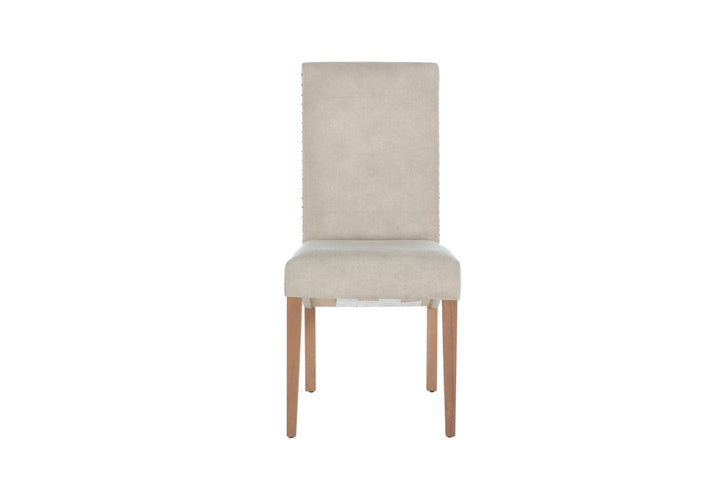 Margo Dining Chair with nailhead embellished sides and warm wood legs, adding elegance to any space.