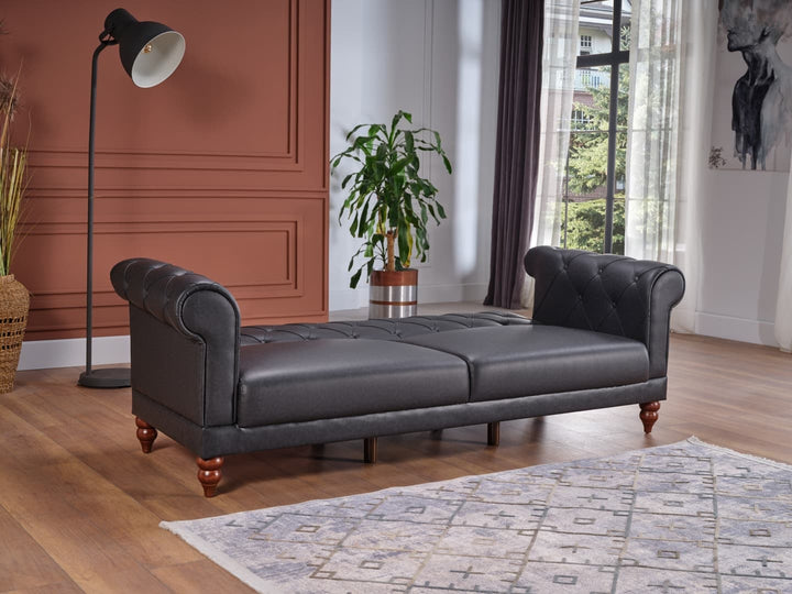 Muse daybed sofa with Chester style. Converts to a sleeper with synthetic leather upholstery, providing both traditional elegance and practical comfort.