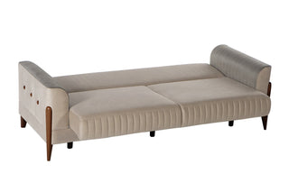 Piero Sleeper Sofa with stylish ribbed pleating and brass button details. Includes built-in storage and a sleeper feature for extra guest comfort.